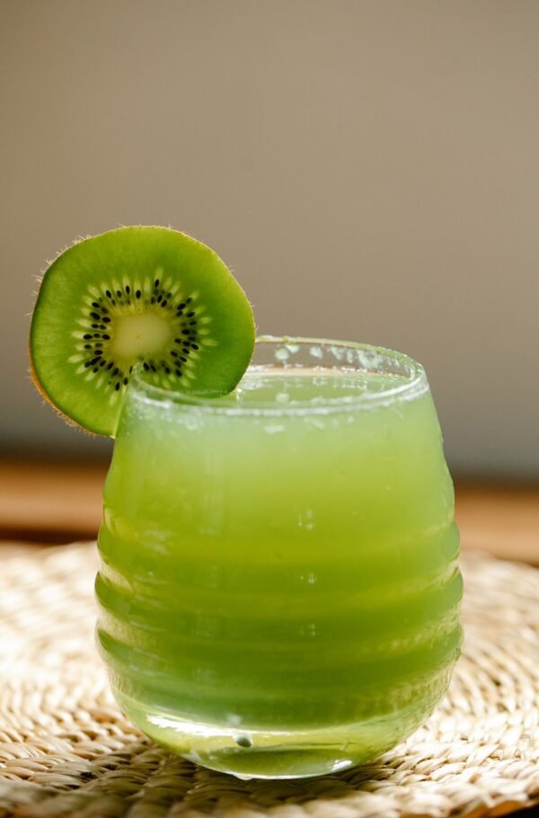 pexels-photo-8679377-1.jpeg Glass of NFC kiwifruit juice garnished with a fresh slice